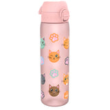 A pink water bottle, adorned with cartoon cats and paw prints, sits against a white background. The bottle has a pink lid with a flip-top. The word 