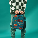 A rectangular teal lunchbox showcases colorful cartoon vehicles including cars, buses, and trucks with road signs such as 