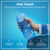 A light-blue water bottle, featuring cartoon sharks and other sea creatures, sits against a white background. The bottle displays the word 